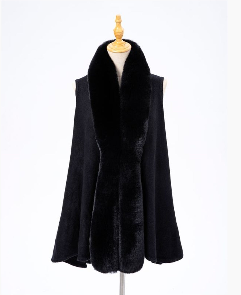 Black cape with faux fur collar.