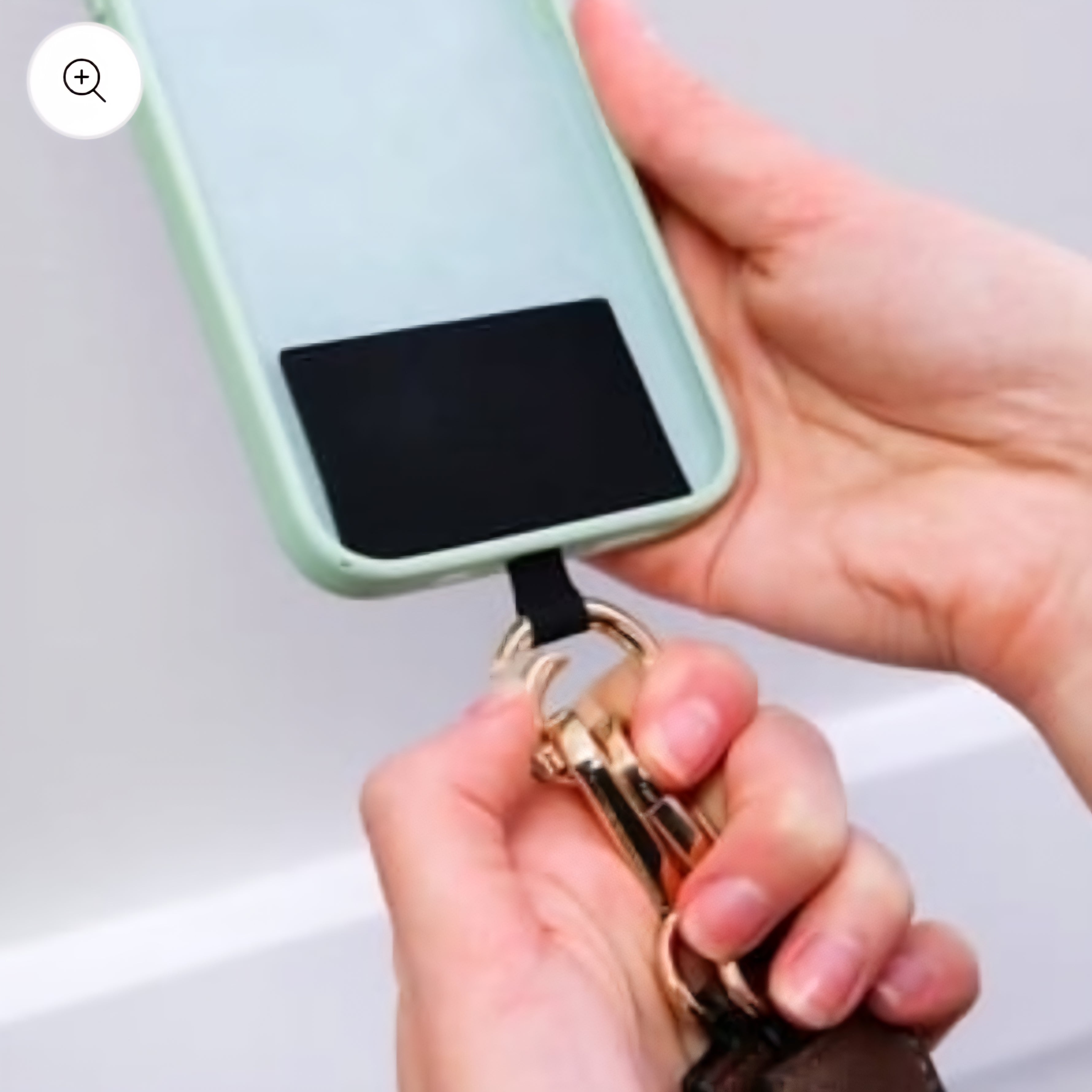 Phone case with lanyard attachment.