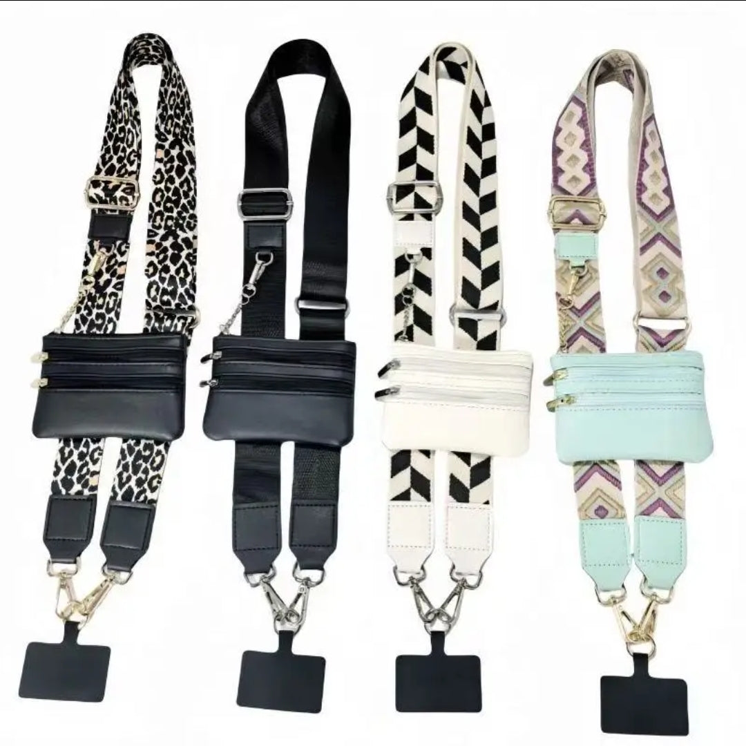 Four patterned purse straps with pouches and phone holders.