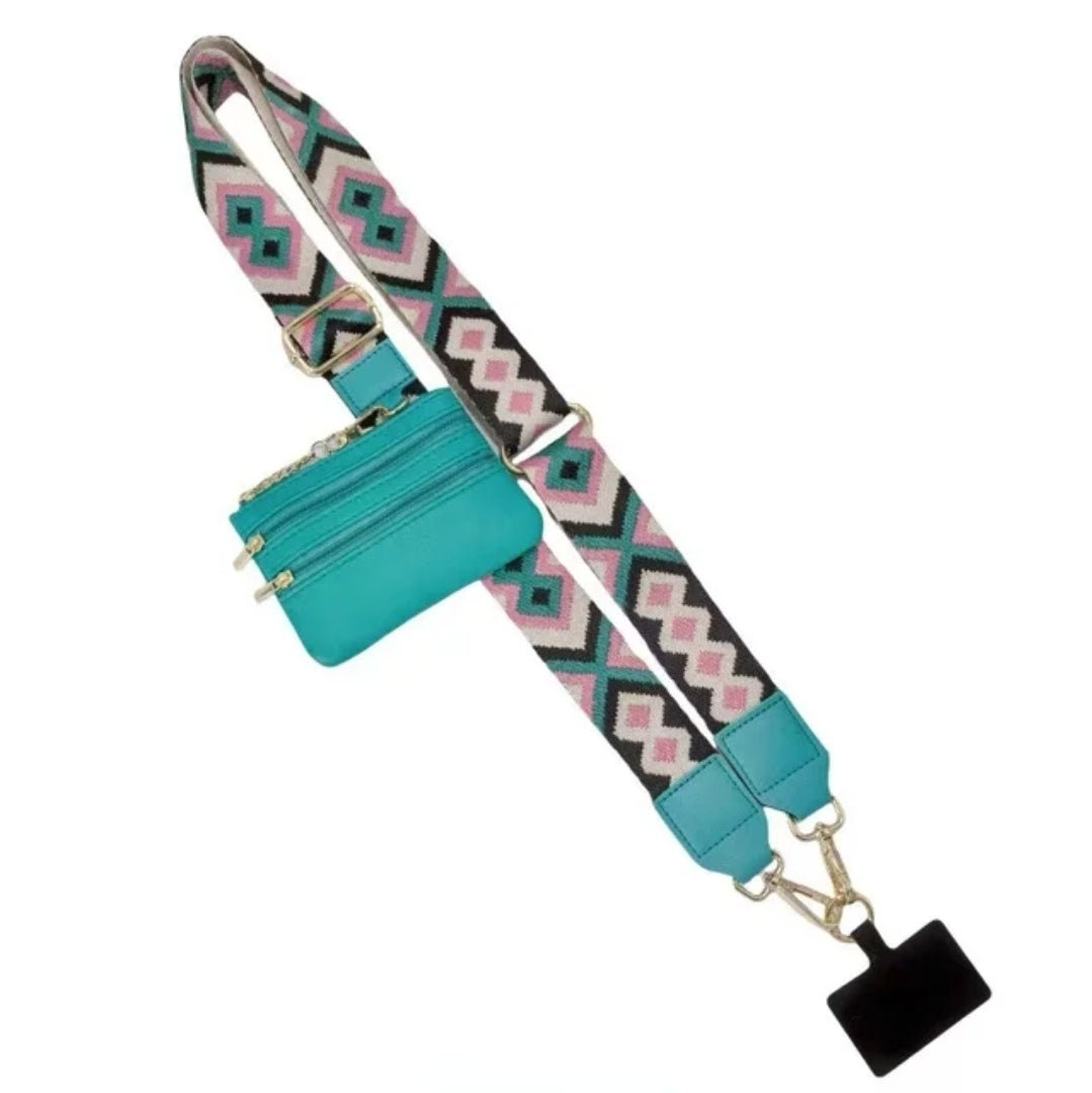 Turquoise bag with patterned strap.