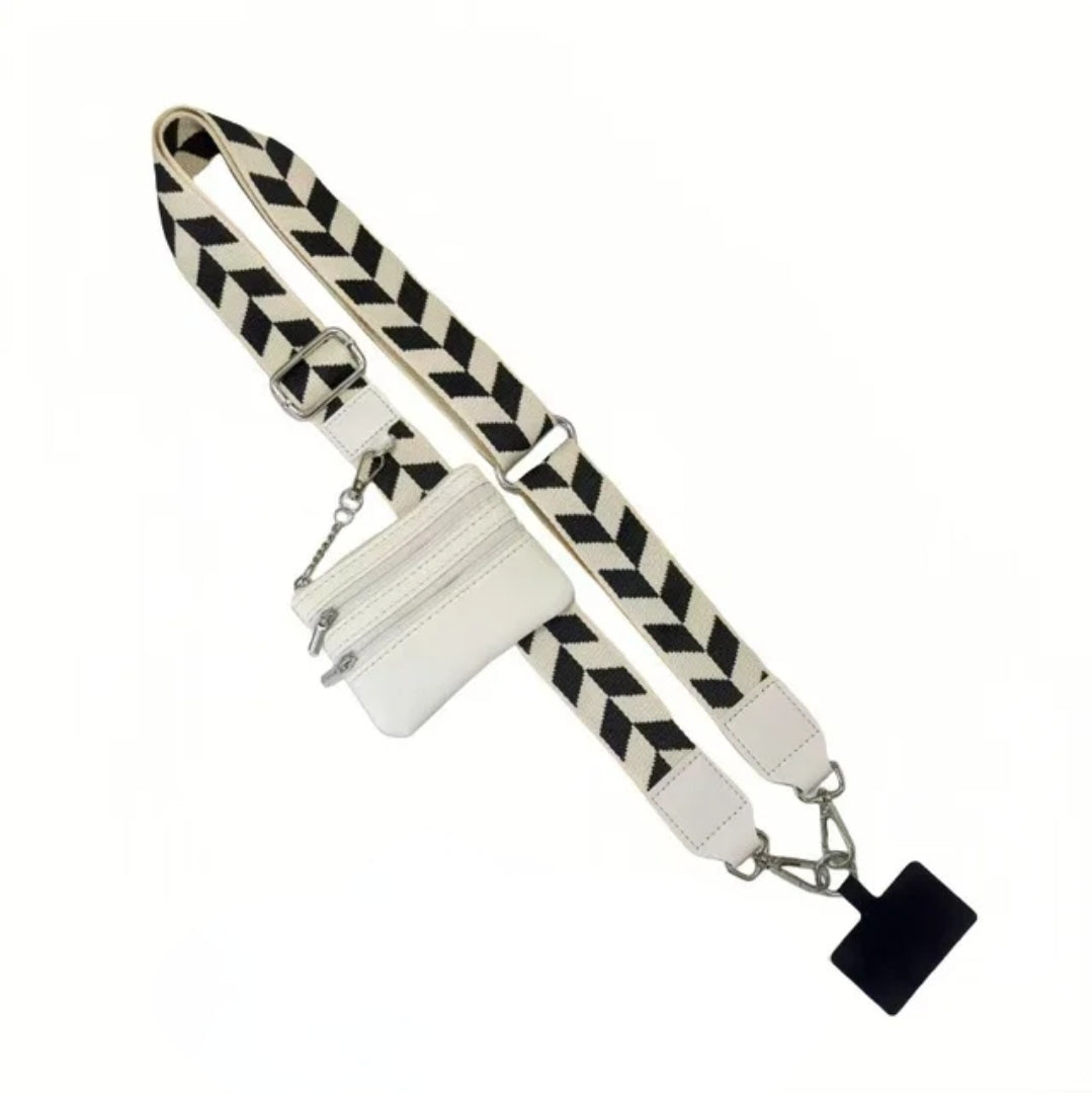 White and black patterned phone strap with small white purse.
