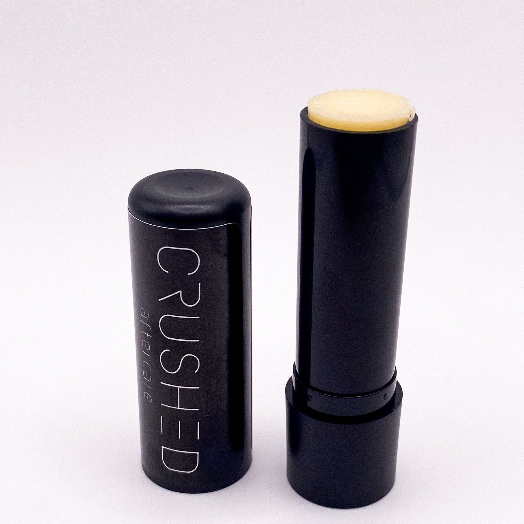 Black lip balm tube with cap.