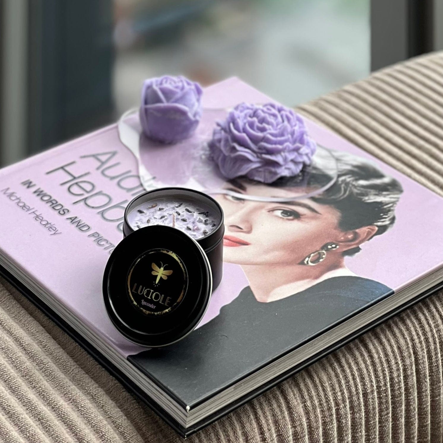 Lavender scented candle and rose soaps on Audrey Hepburn book