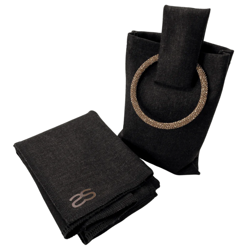 Black handbag with decorative handle and matching scarf