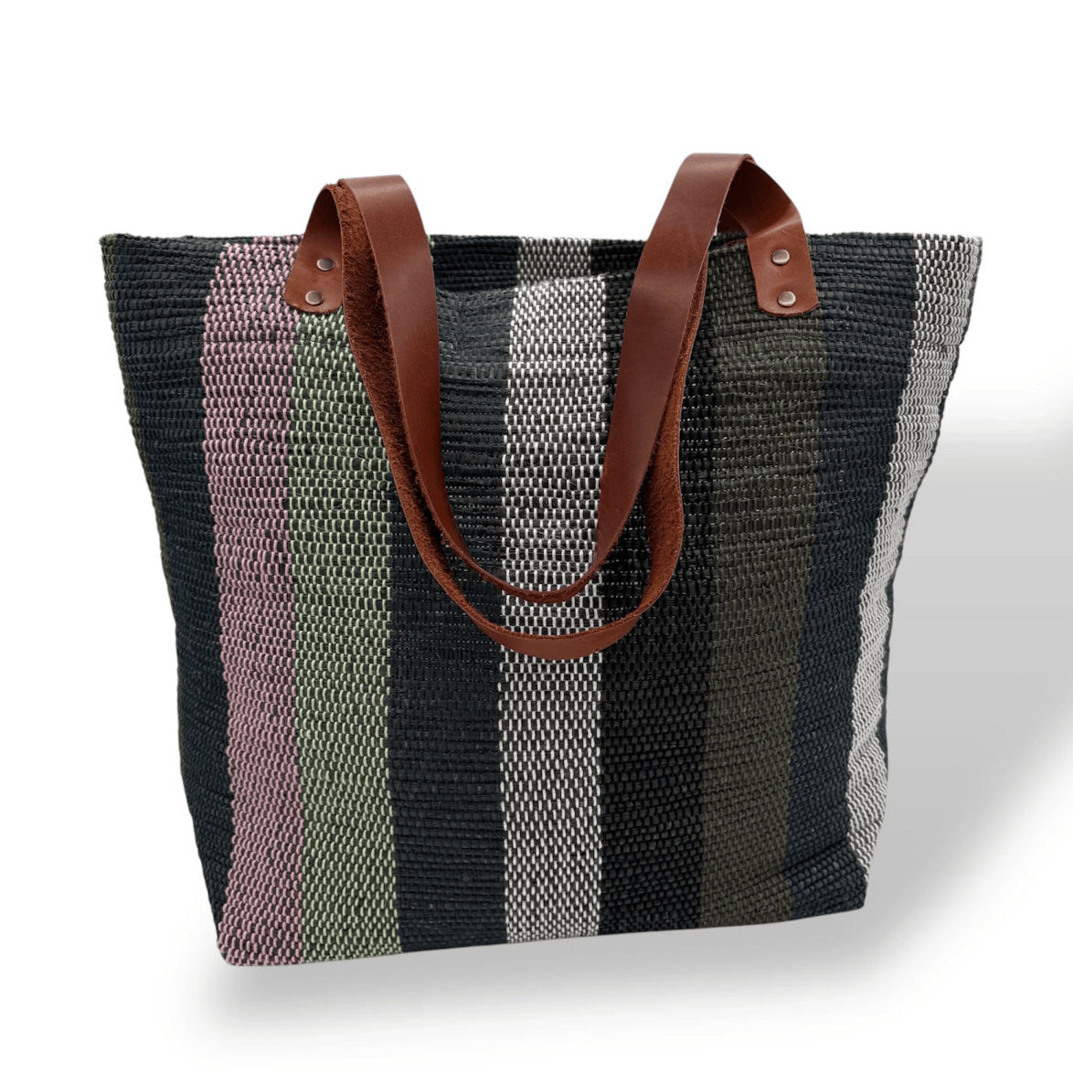 Striped tote bag with leather handles, seen on June 30, 2025.