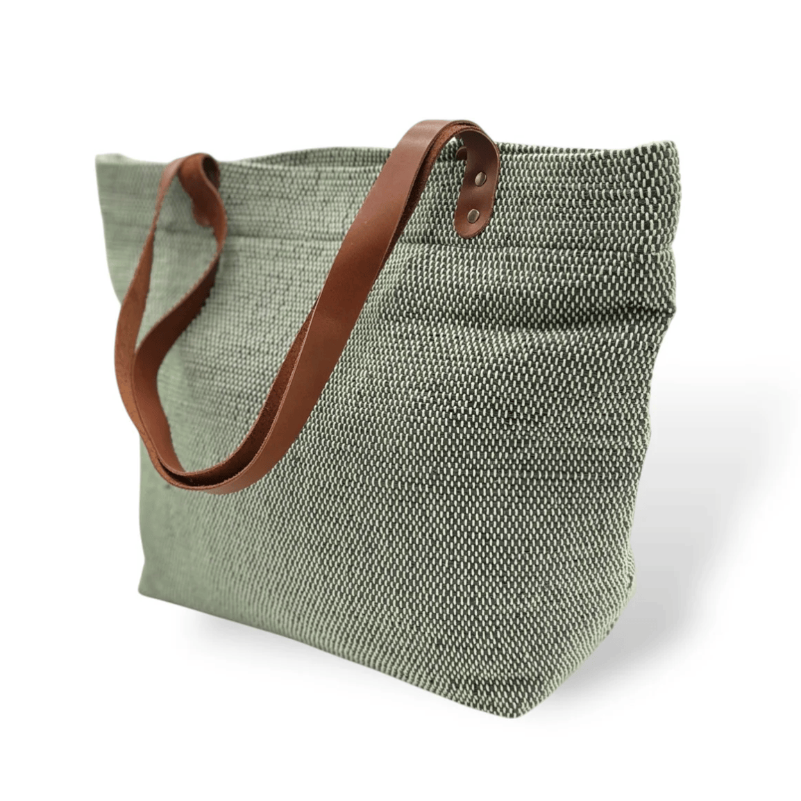 Green tote bag with leather handles, screenshot June 30, 2025.