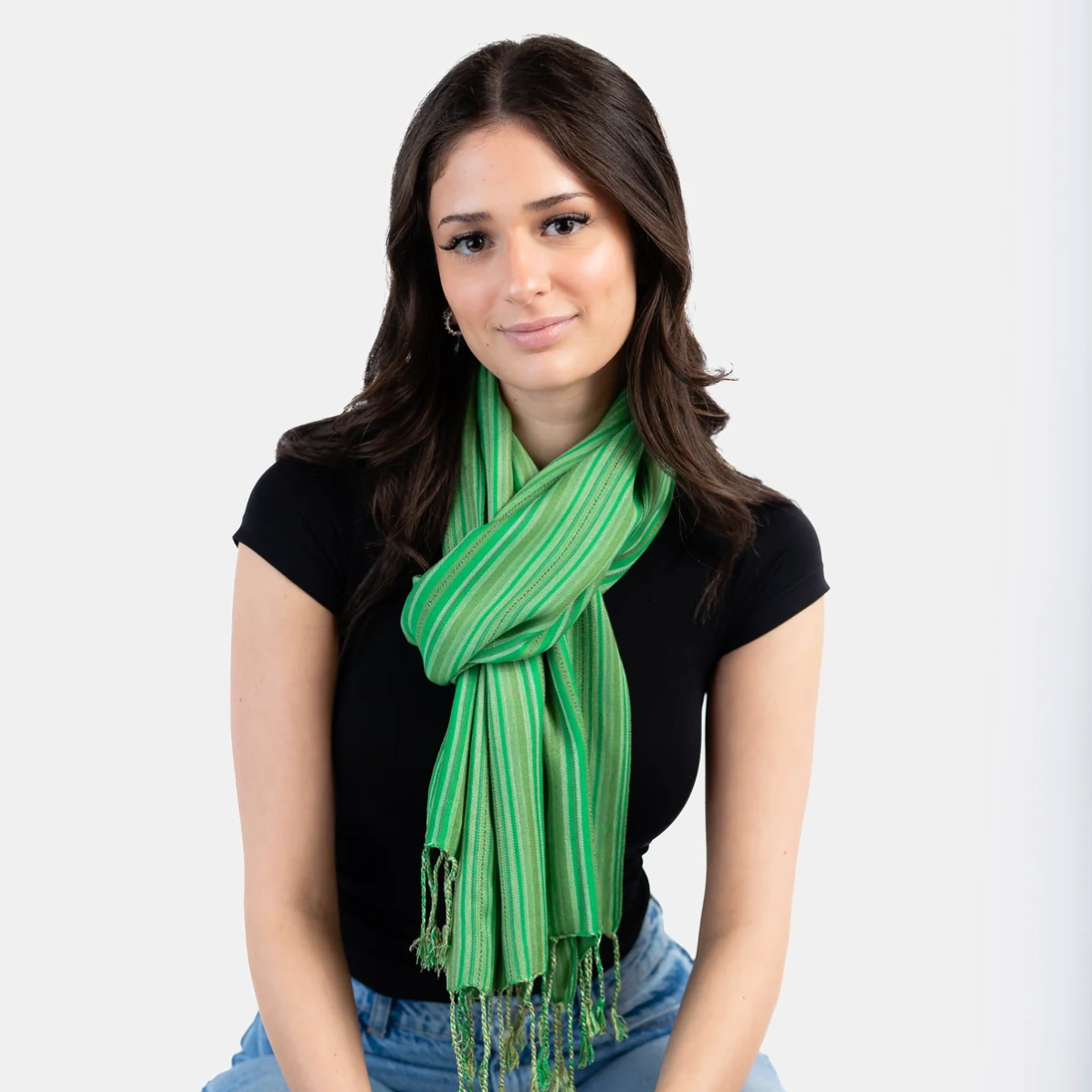 Woman wearing green striped scarf - Screenshot June 30, 2025