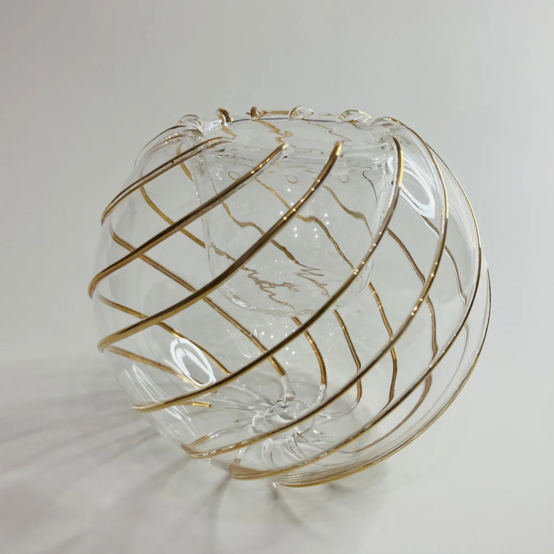 Screenshot of a decorative glass orb with gold stripes