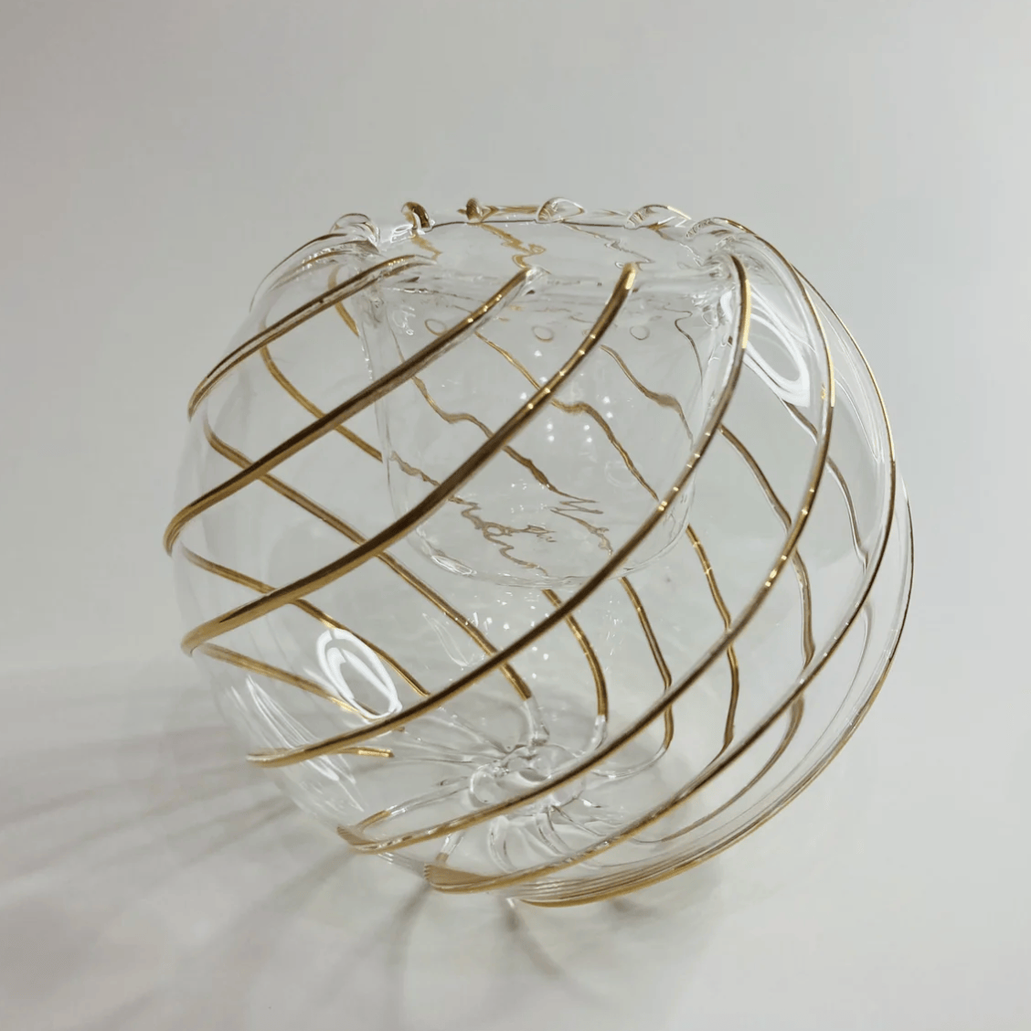 Screenshot of a decorative glass orb with gold stripes