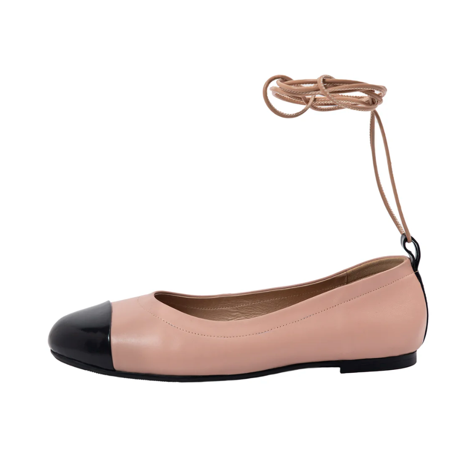 Pink ballet flats with black cap toe and ankle tie, screenshot July 15, 2025