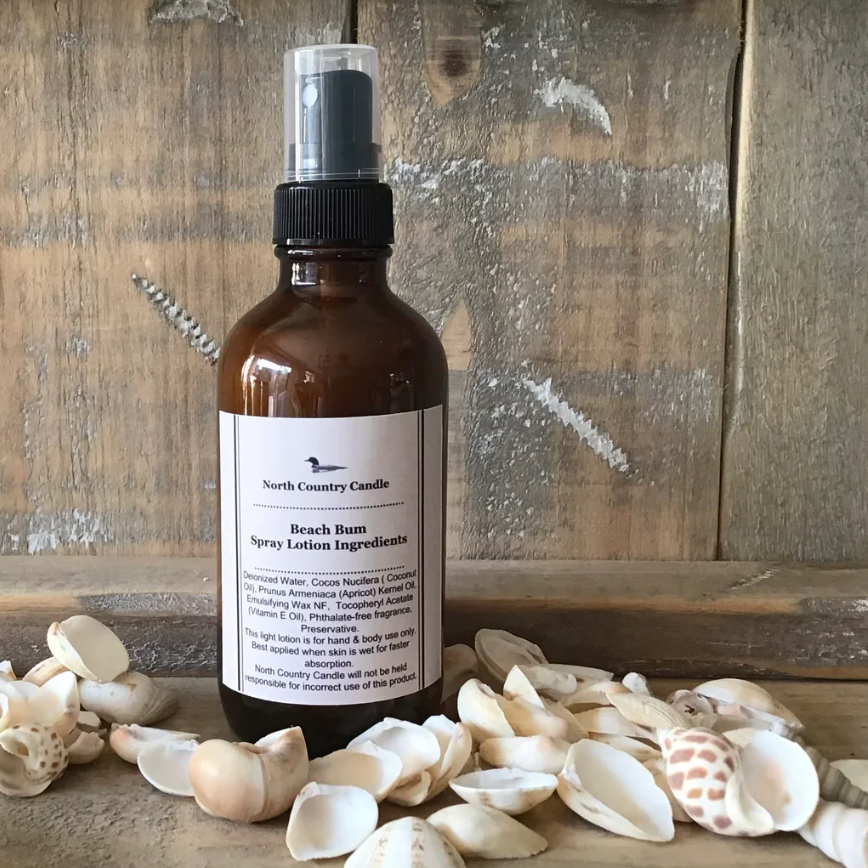 Beach Bum Spray Lotion bottle with seashells.