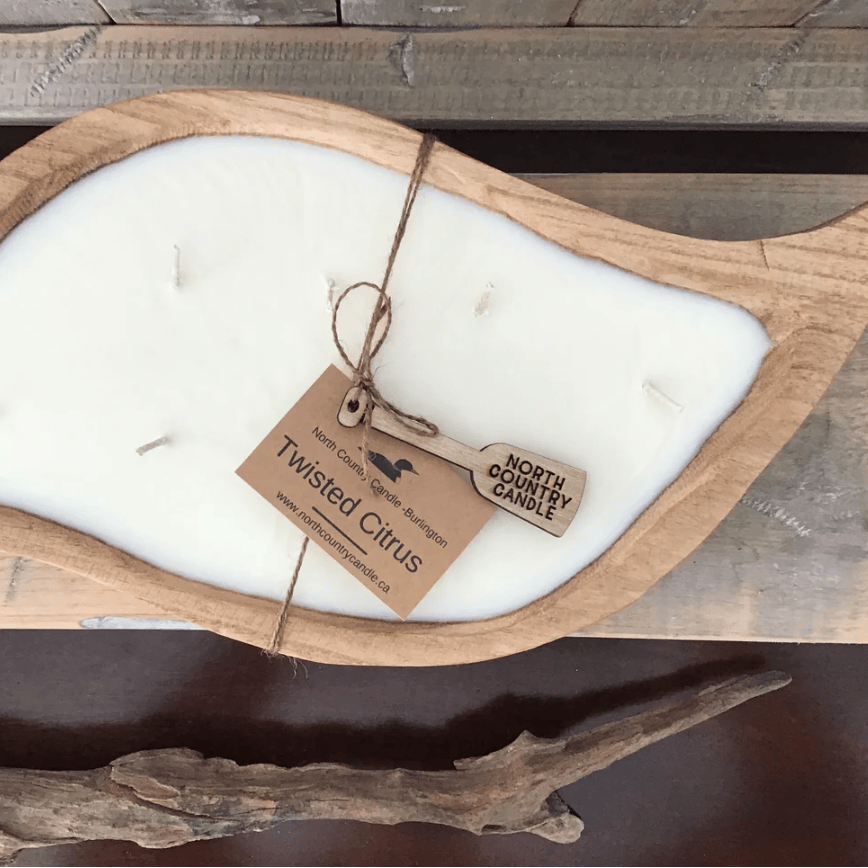 Screenshot of Twisted Citrus candle in wooden holder.