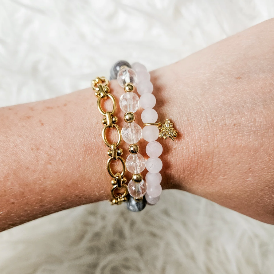 Bracelet stack on wrist, screenshot from July 21, 2025.