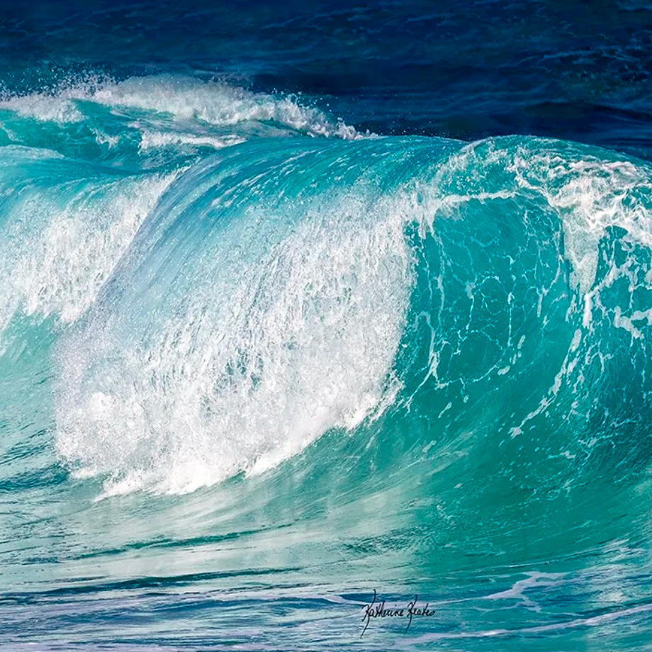 Screenshot of a turquoise ocean wave crashing