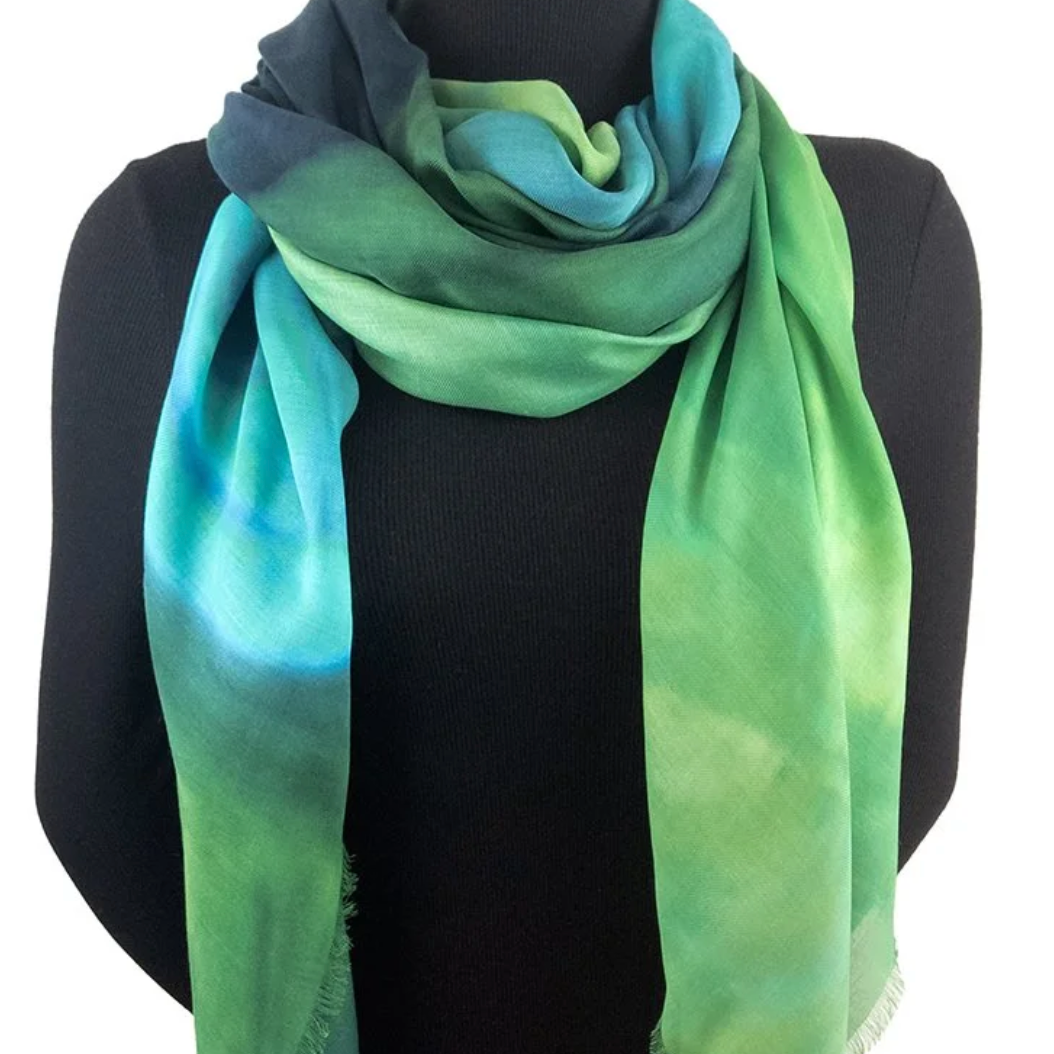 Green and blue scarf on a black mannequin, August 11, 2025.