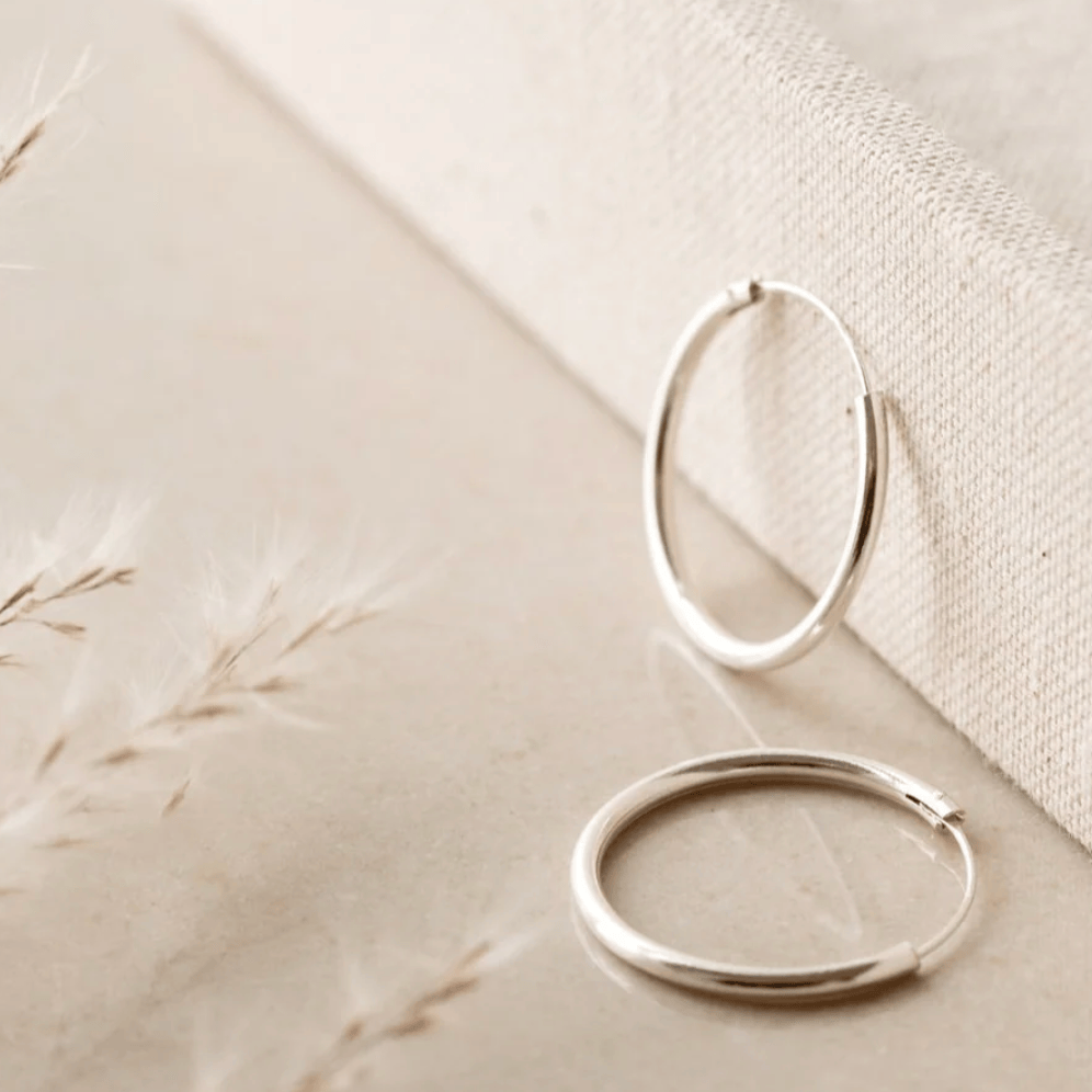 Silver hoop earrings - Screenshot August 27, 2025