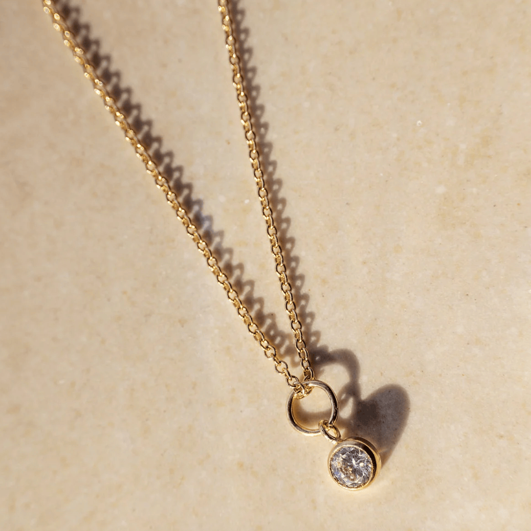 Gold pendant necklace with a single diamond, August 27, 2025 screenshot.
