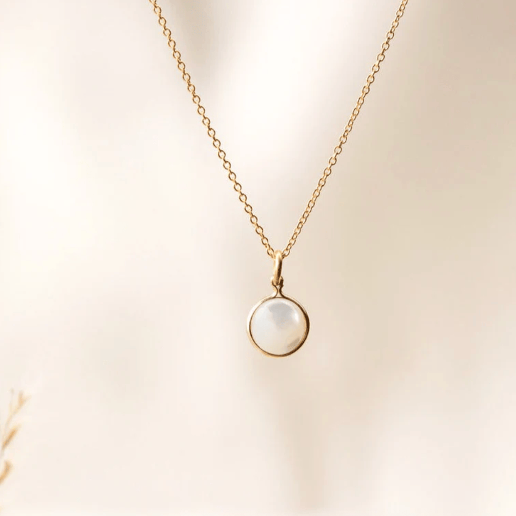 Screenshot of gold necklace with pearl pendant, August 27, 2025.