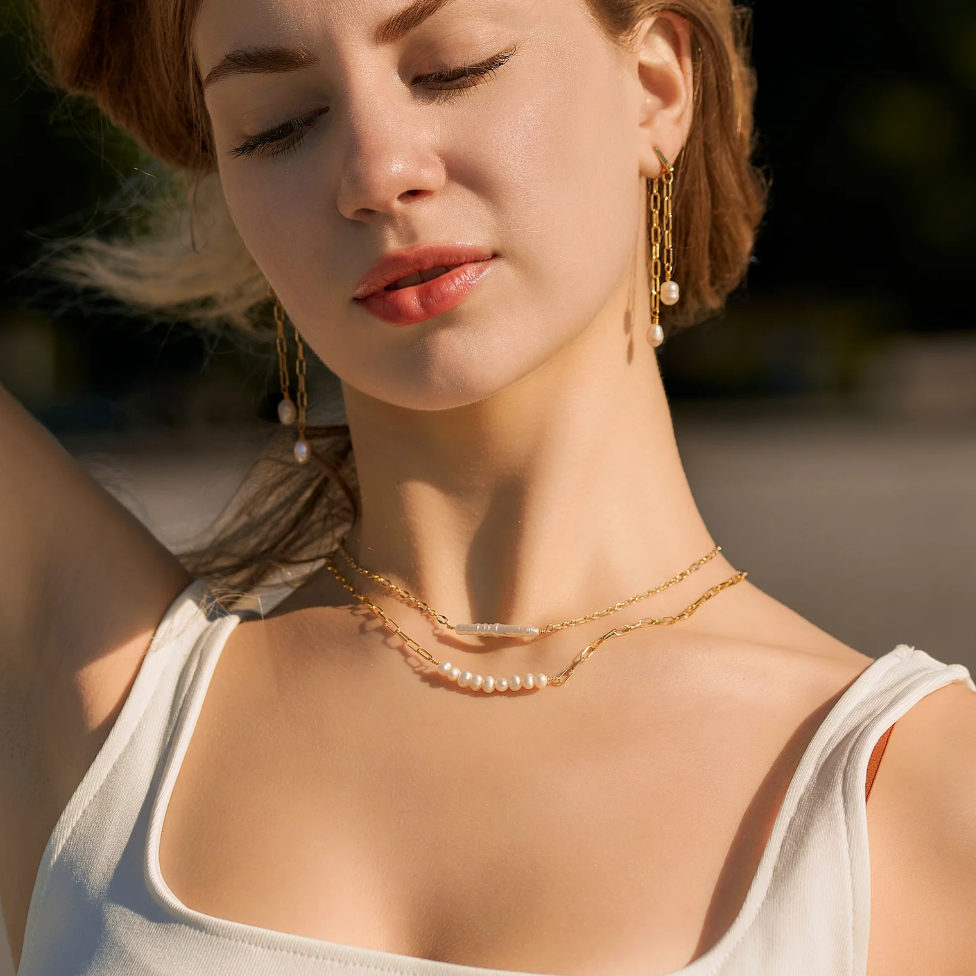 Woman wearing pearl necklace, screenshot from Sept 4, 2025