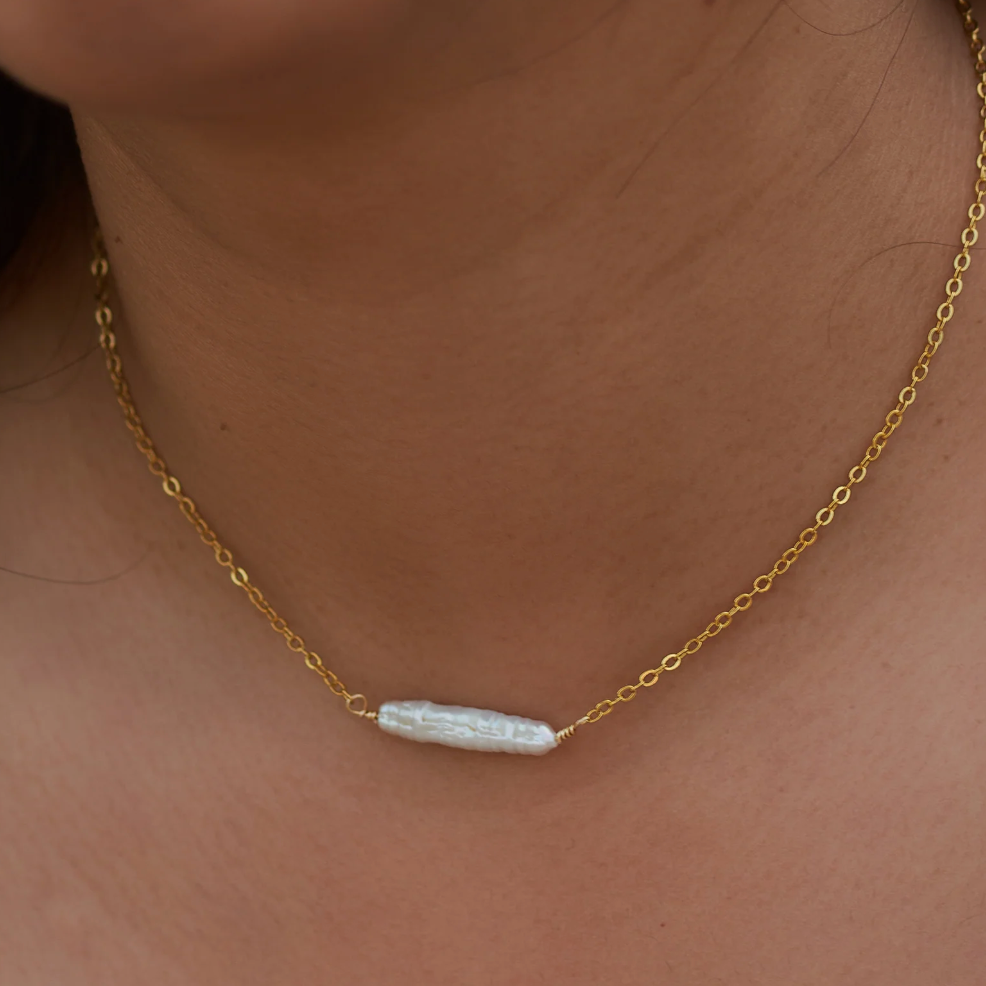 Gold necklace with a pearl, screenshot from Sep 4, 2025.