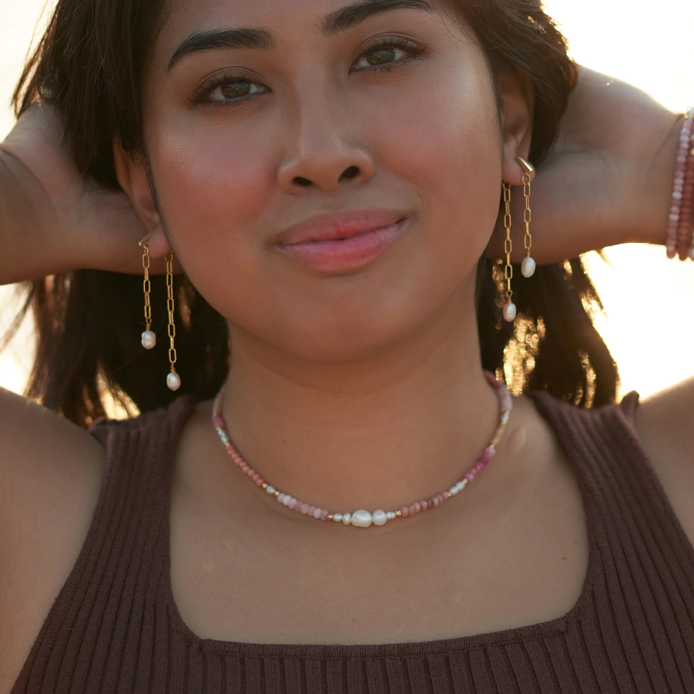 Woman wearing jewelry, screenshot Sept 4, 2025