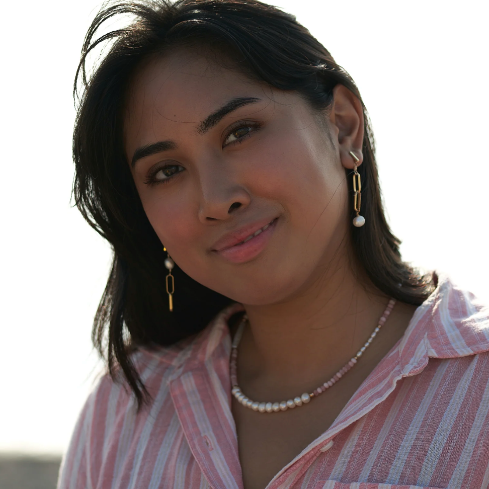 Woman wearing jewelry, screenshot Sept 4, 2025