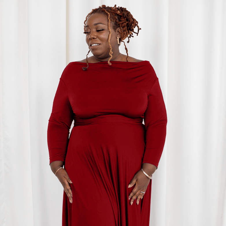 Woman in red dress, screenshot from 2025