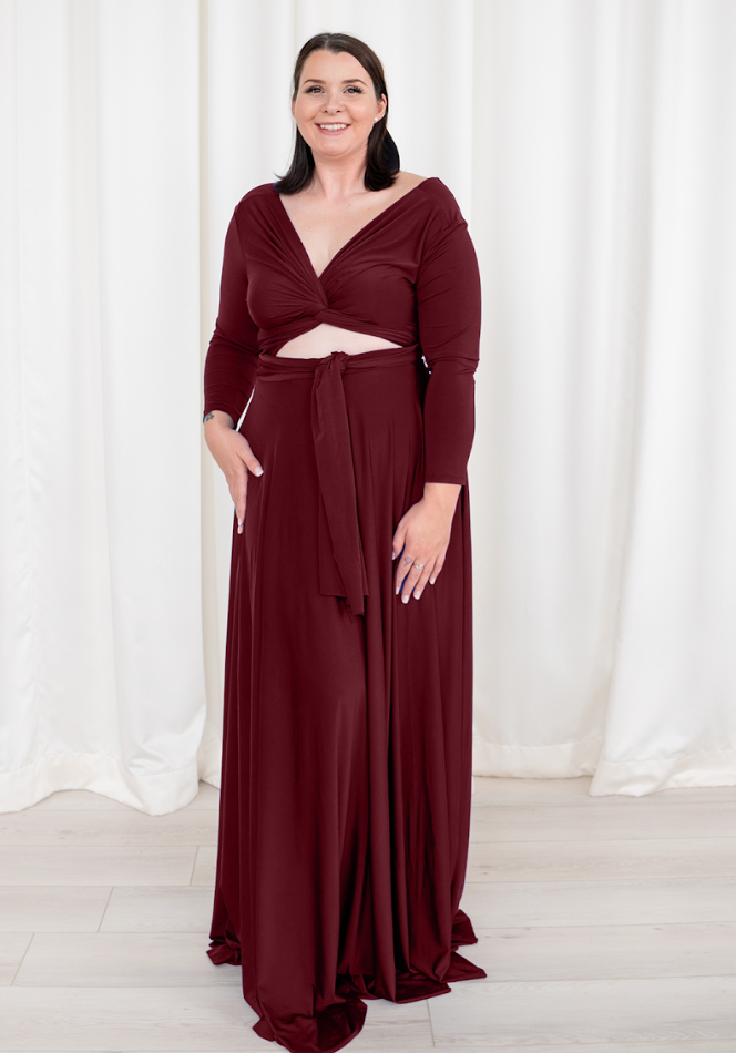 Woman in burgundy dress, screenshot Sept 6, 2025