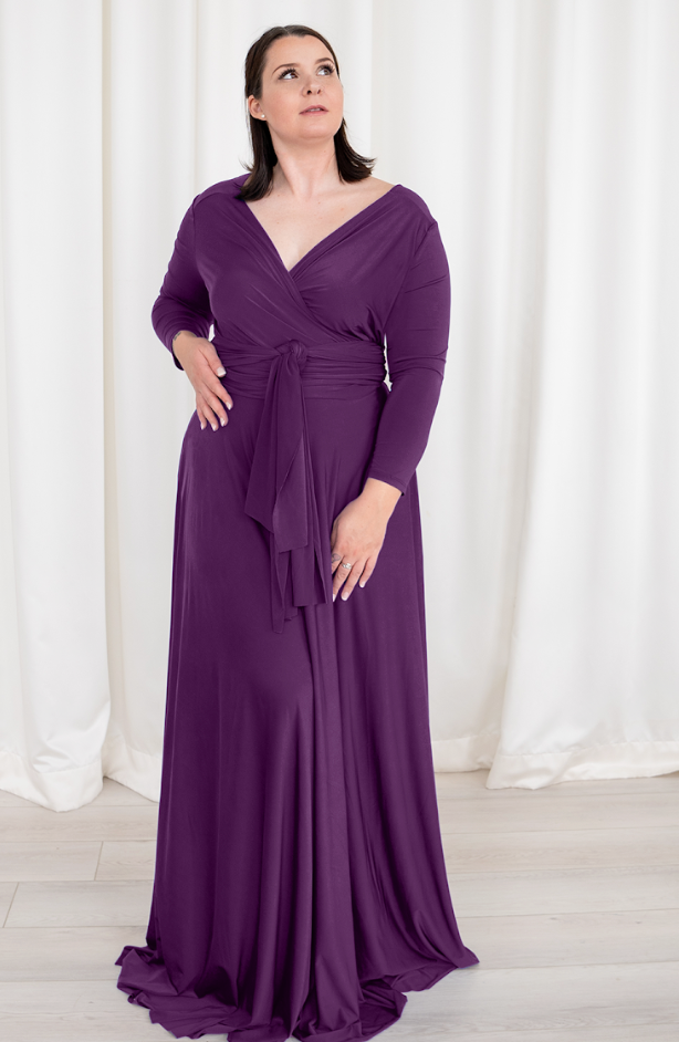 Woman in purple wrap dress, screenshot Sept 6, 2025