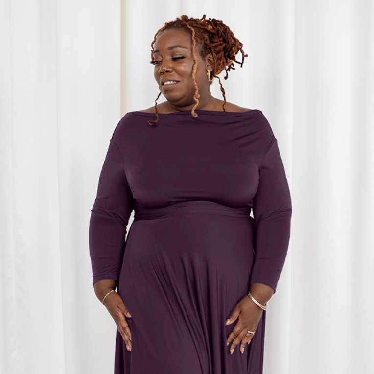 Woman in plum dress, screenshot Sept 6, 2025