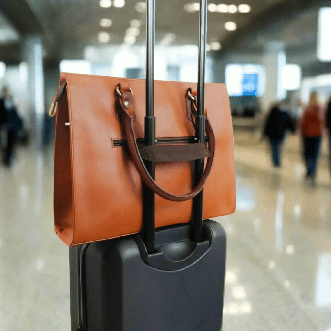 Travel bag on suitcase in airport, Sept 18, 2025