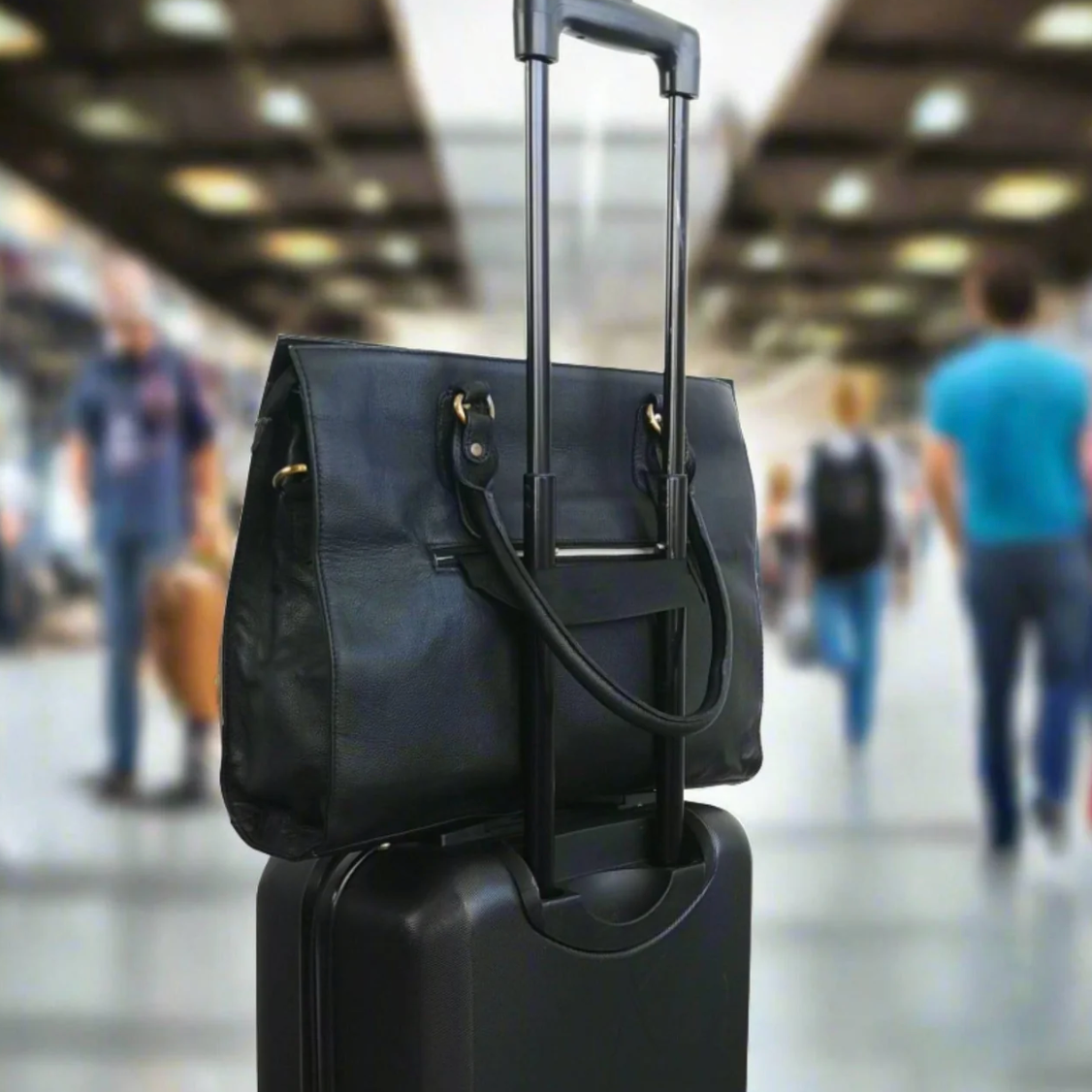 Black carry-on luggage with tote bag at airport, Sept 18, 2025.