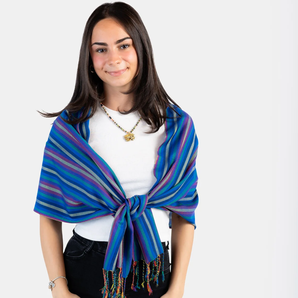 Woman wearing blue striped scarf