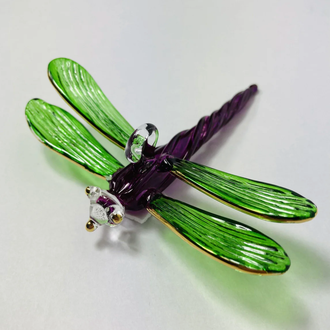 Glass dragonfly figurine, screenshot from June 30, 2025.