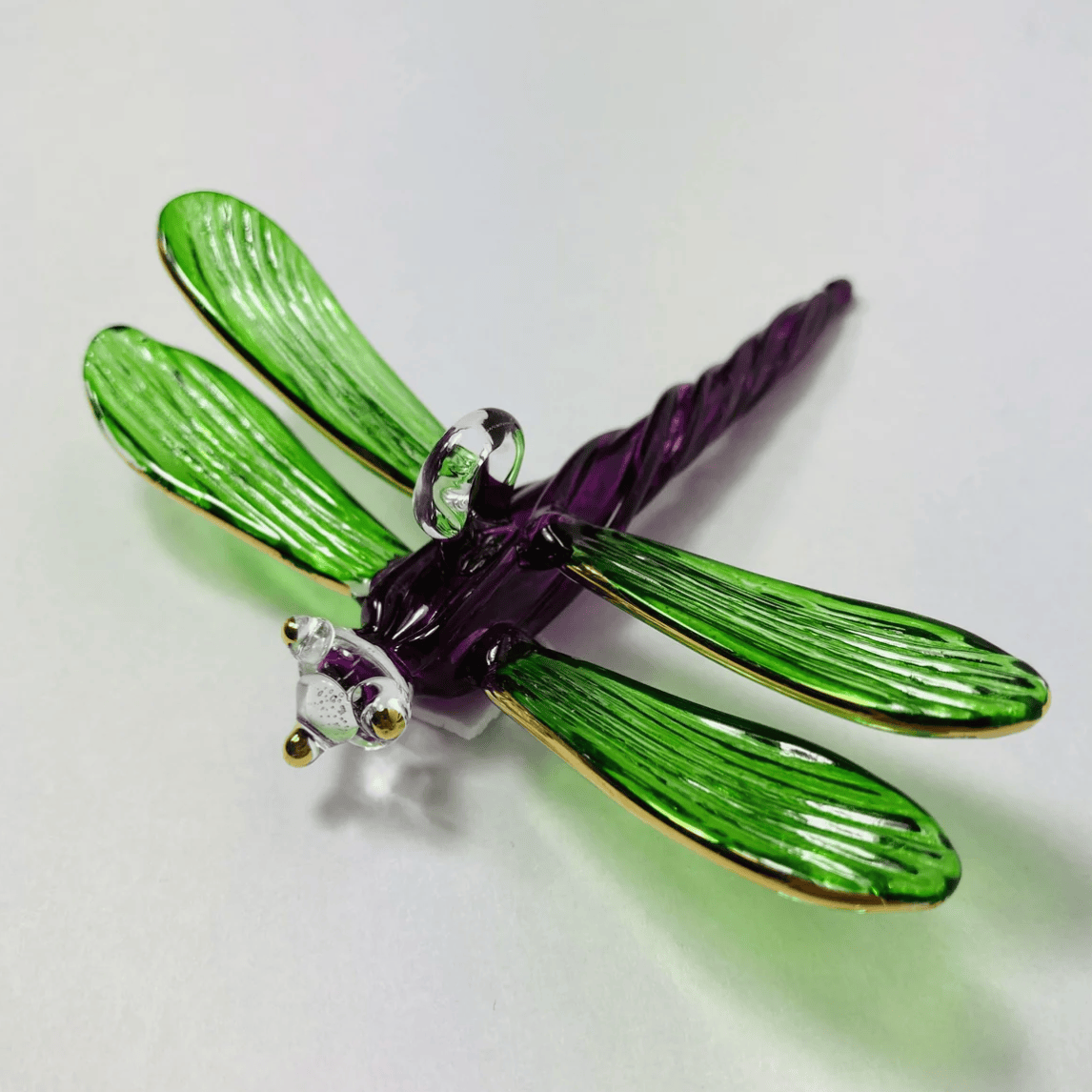Glass dragonfly figurine, screenshot from June 30, 2025.