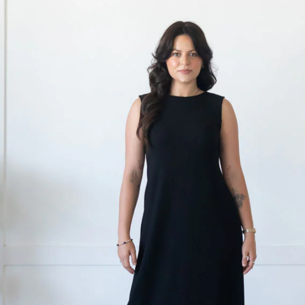 Woman in black dress, screenshot from July 25, 2025.