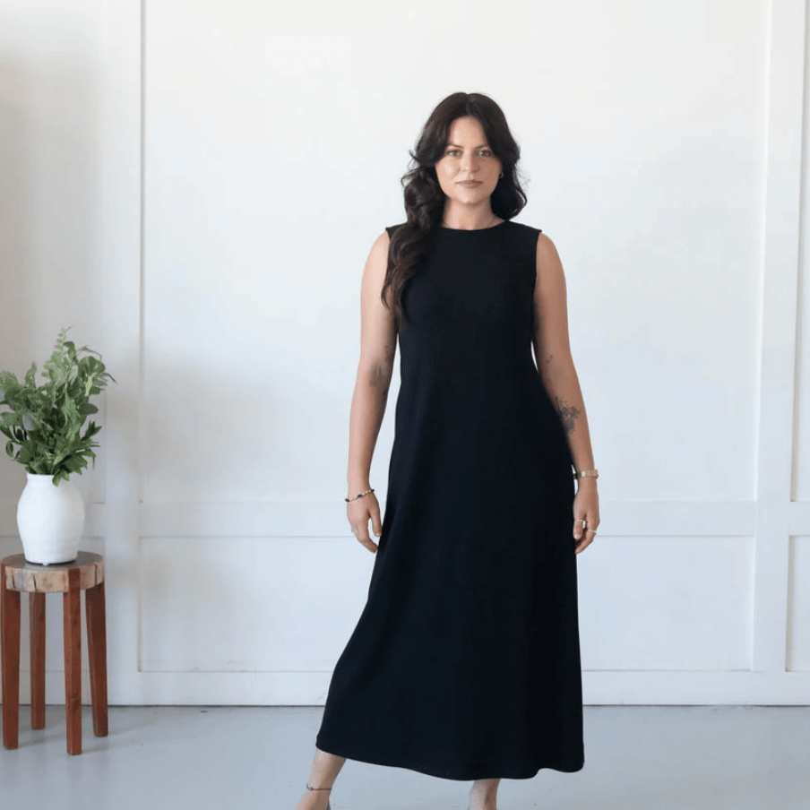 Woman in black dress, screenshot from July 25, 2025.