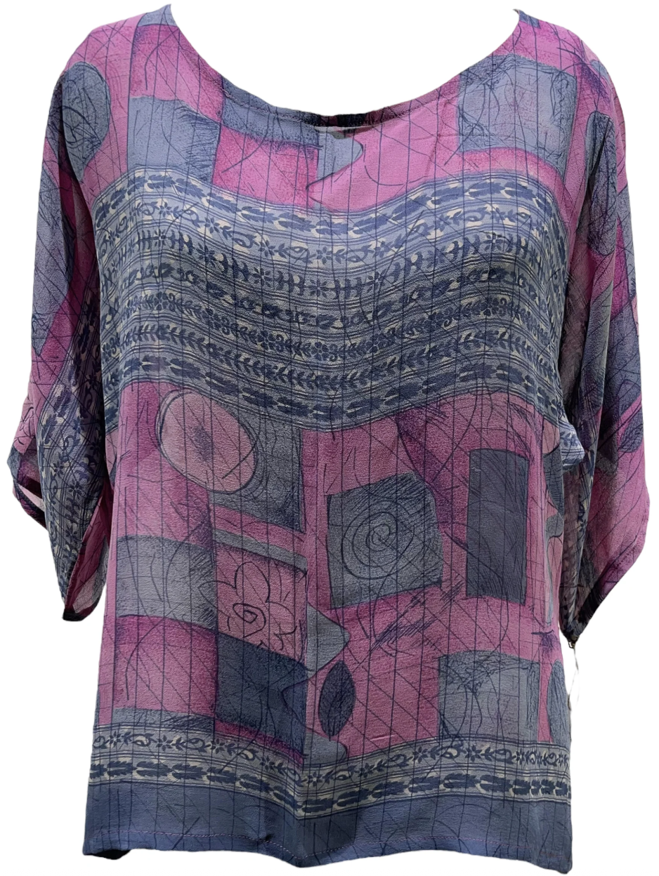 Pink & blue patterned blouse, screenshot from August 10, 2025