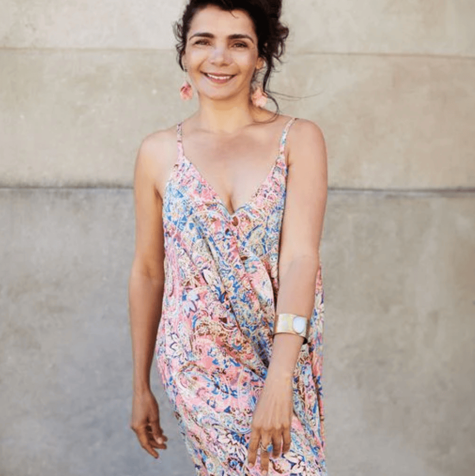 Woman in colorful dress, screenshot Aug 16, 2025