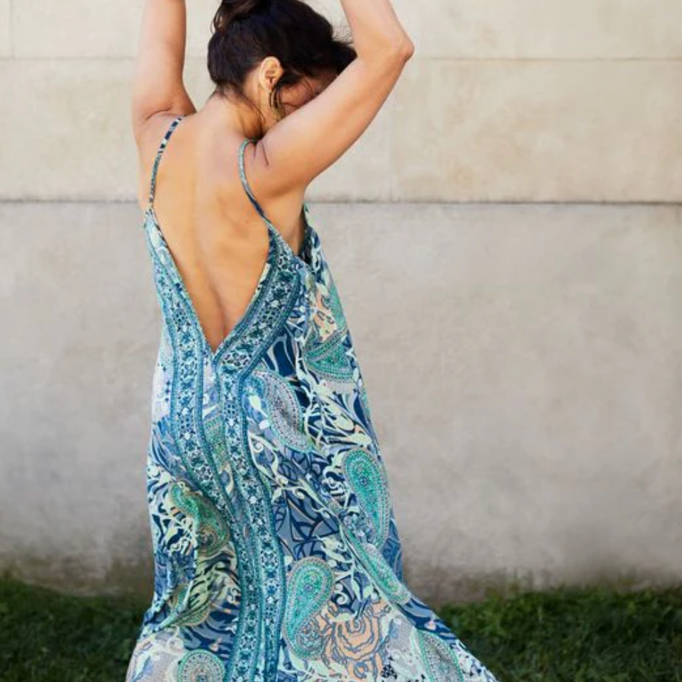 Woman in blue patterned sundress, Aug 16, 2025 screenshot.