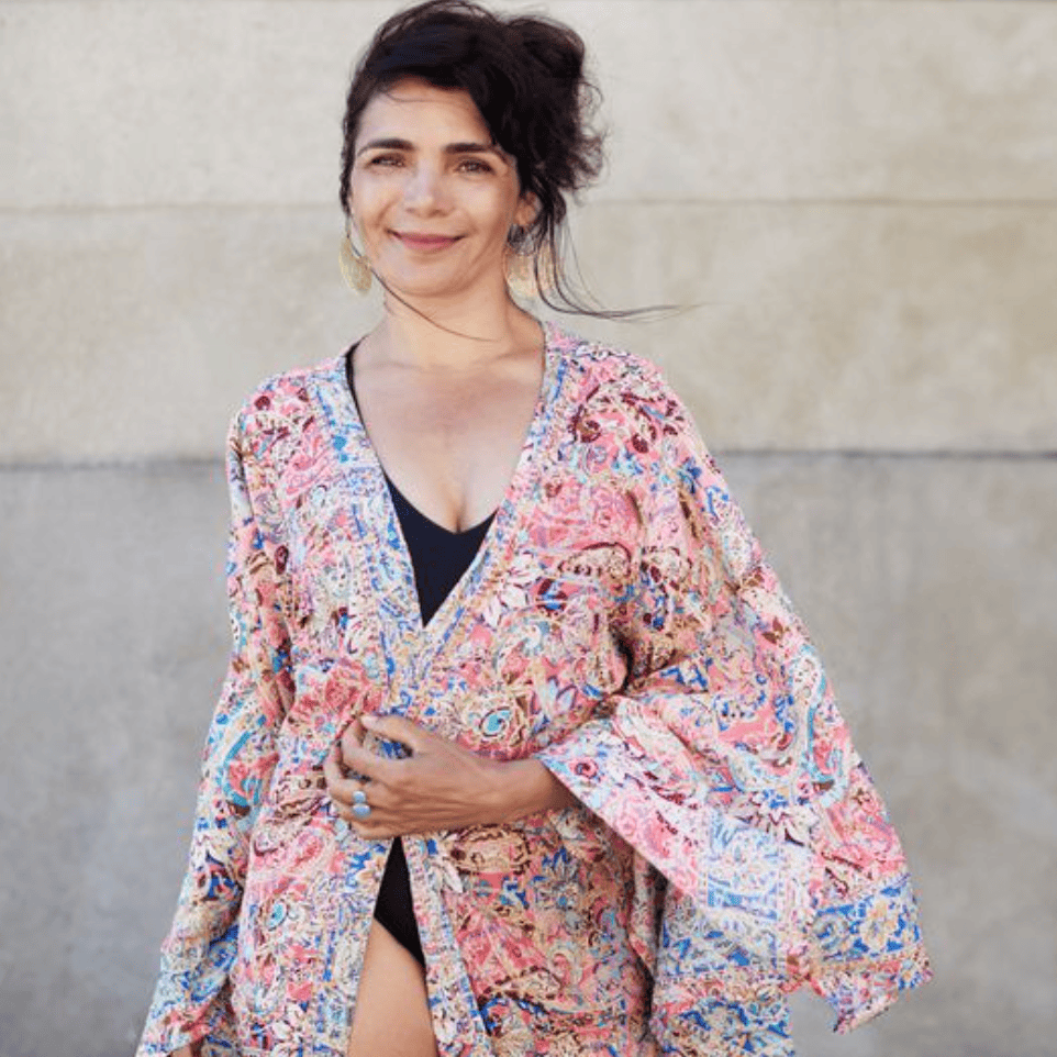 Woman in floral kimono, screenshot from August 16, 2025.