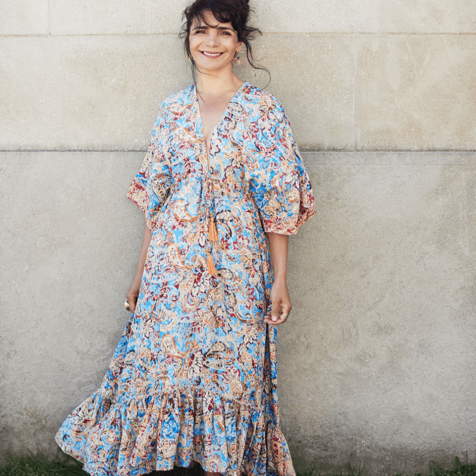 Woman in paisley dress, screenshot from August 16, 2025