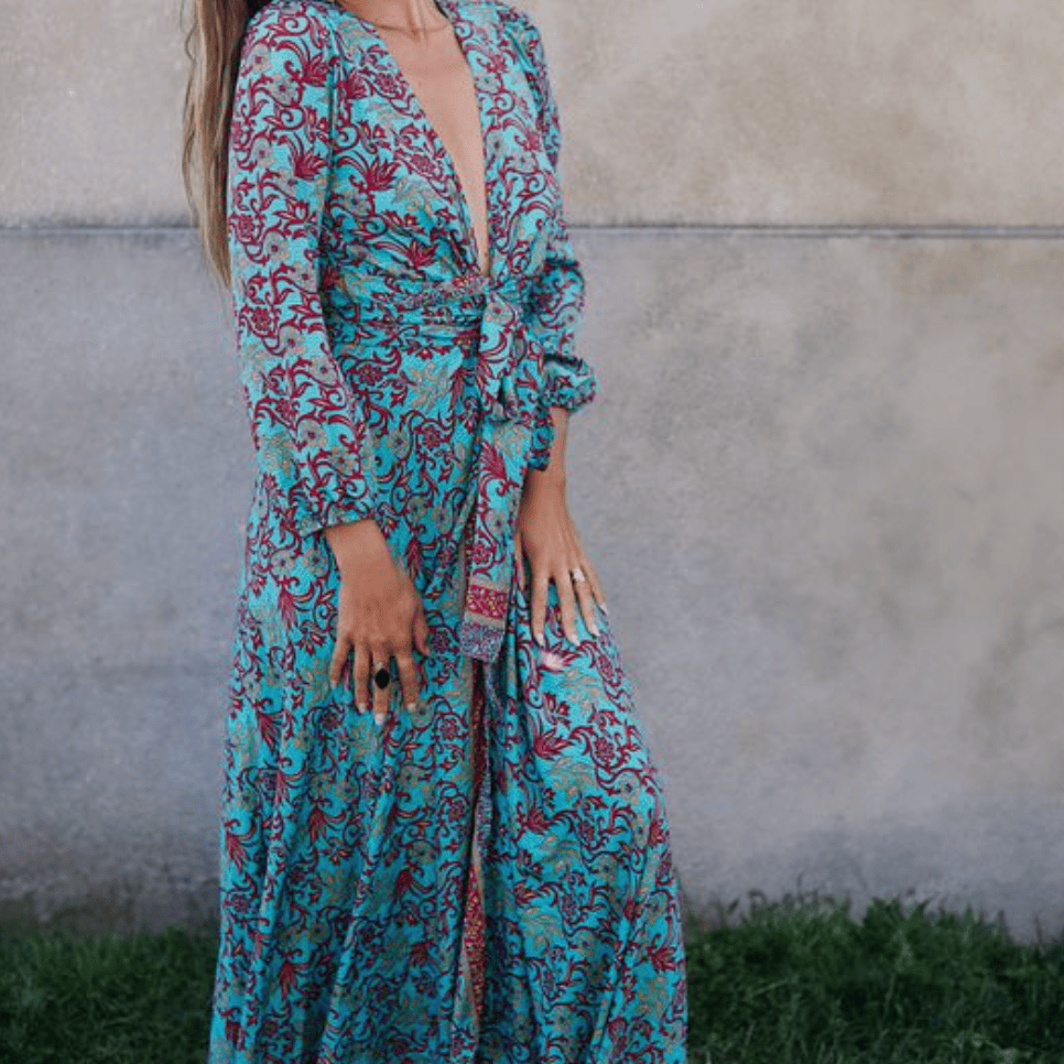 Woman in blue floral maxi dress, August 16, 2025 screenshot.