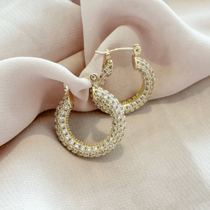 Gold hoop earrings with pave crystals, screenshot from August 2025.
