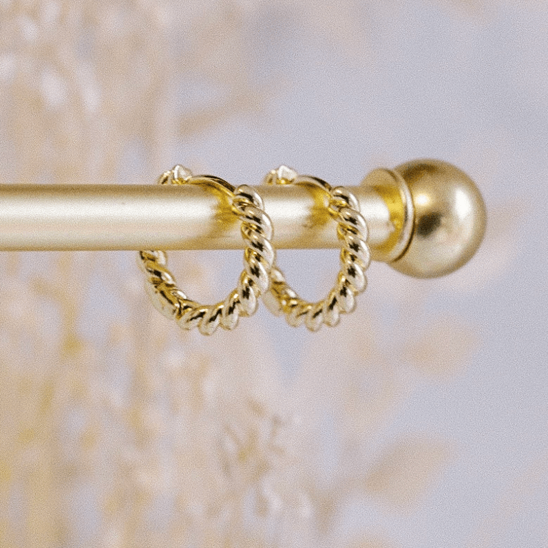 Gold twisted hoop earrings, screenshot from Aug 22, 2025.