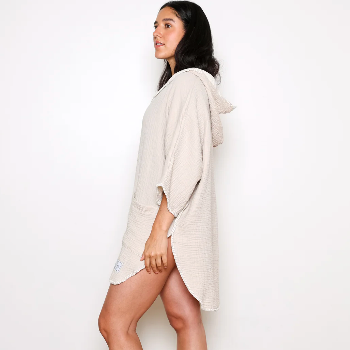 Woman in beige hooded poncho, August 29 screenshot.