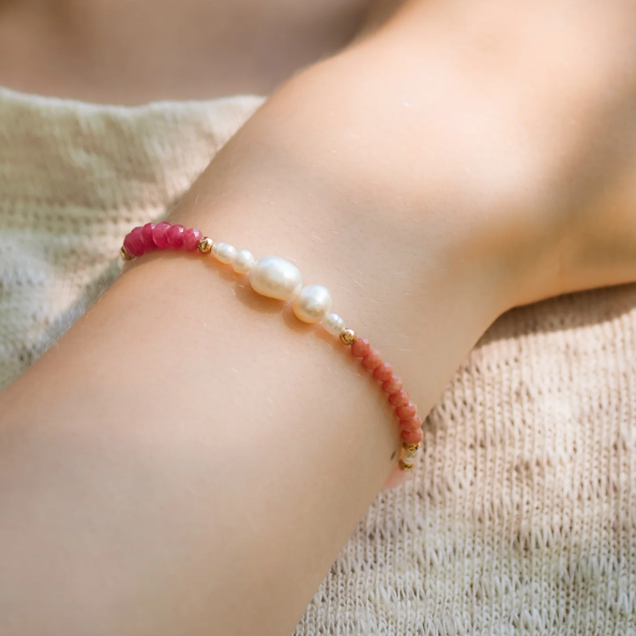 Screenshot of pearl and pink gemstone bracelet on wrist, September 4, 2025.