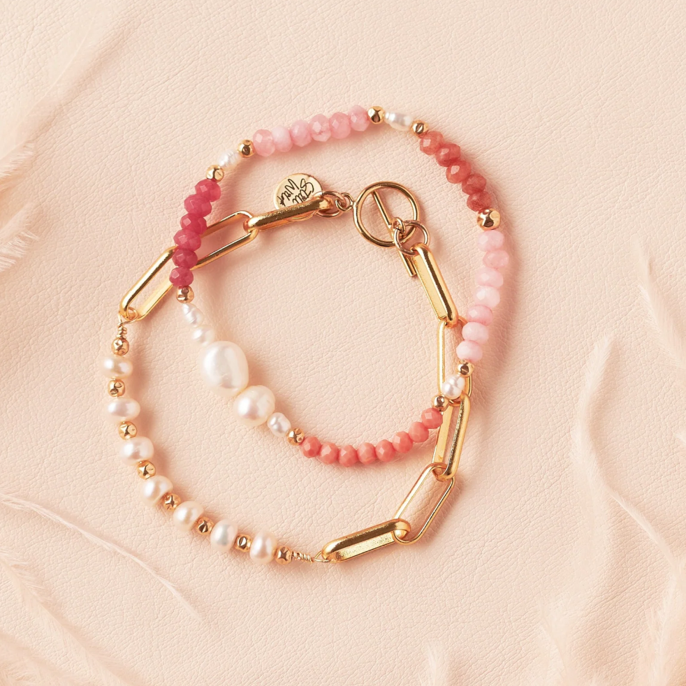Screenshot of two pink and gold bracelets.