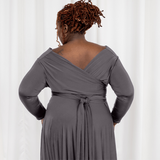 Woman in gray wrap dress, captured September 6, 2025