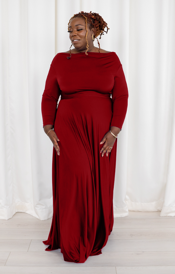 Woman in red maxi dress, screenshot from 2025.